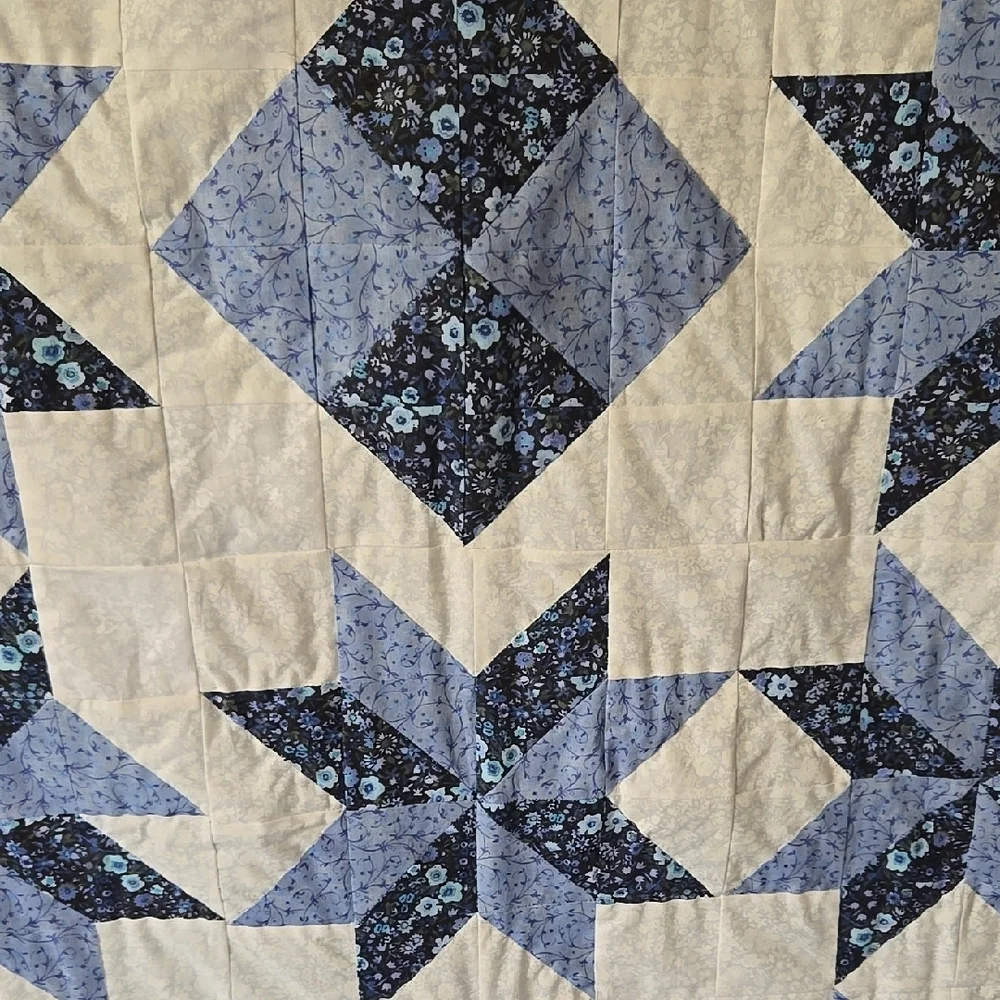 Blue and White Star Pattern Quilt